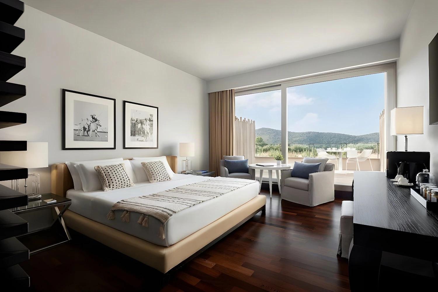 Chambre moderne et lumineuse à l'Argentario Golf Resort & Spa avec vue sur la terrasse.