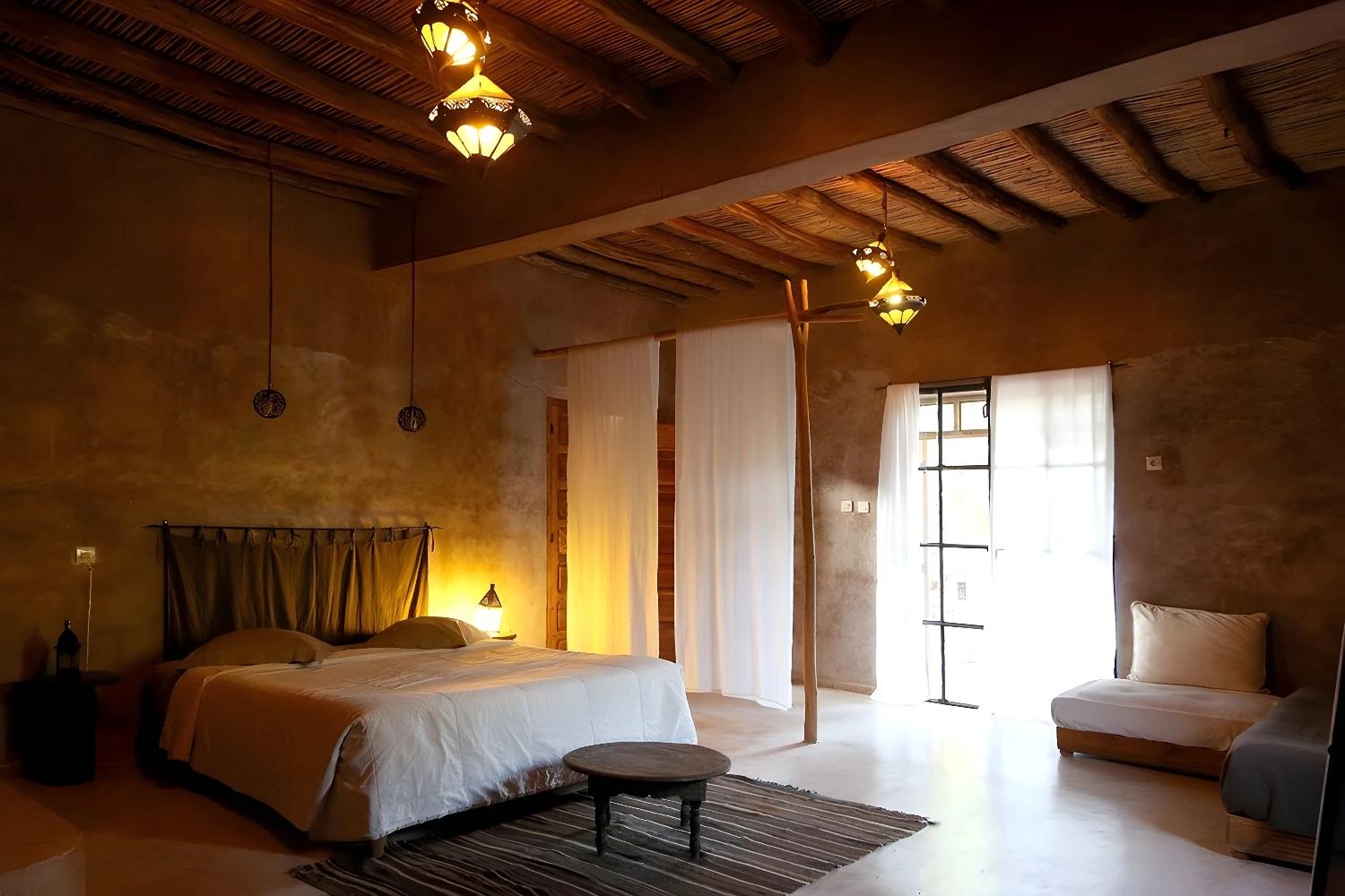 Chambre spacieuse avec décoration rustique à La Ferme Berbère