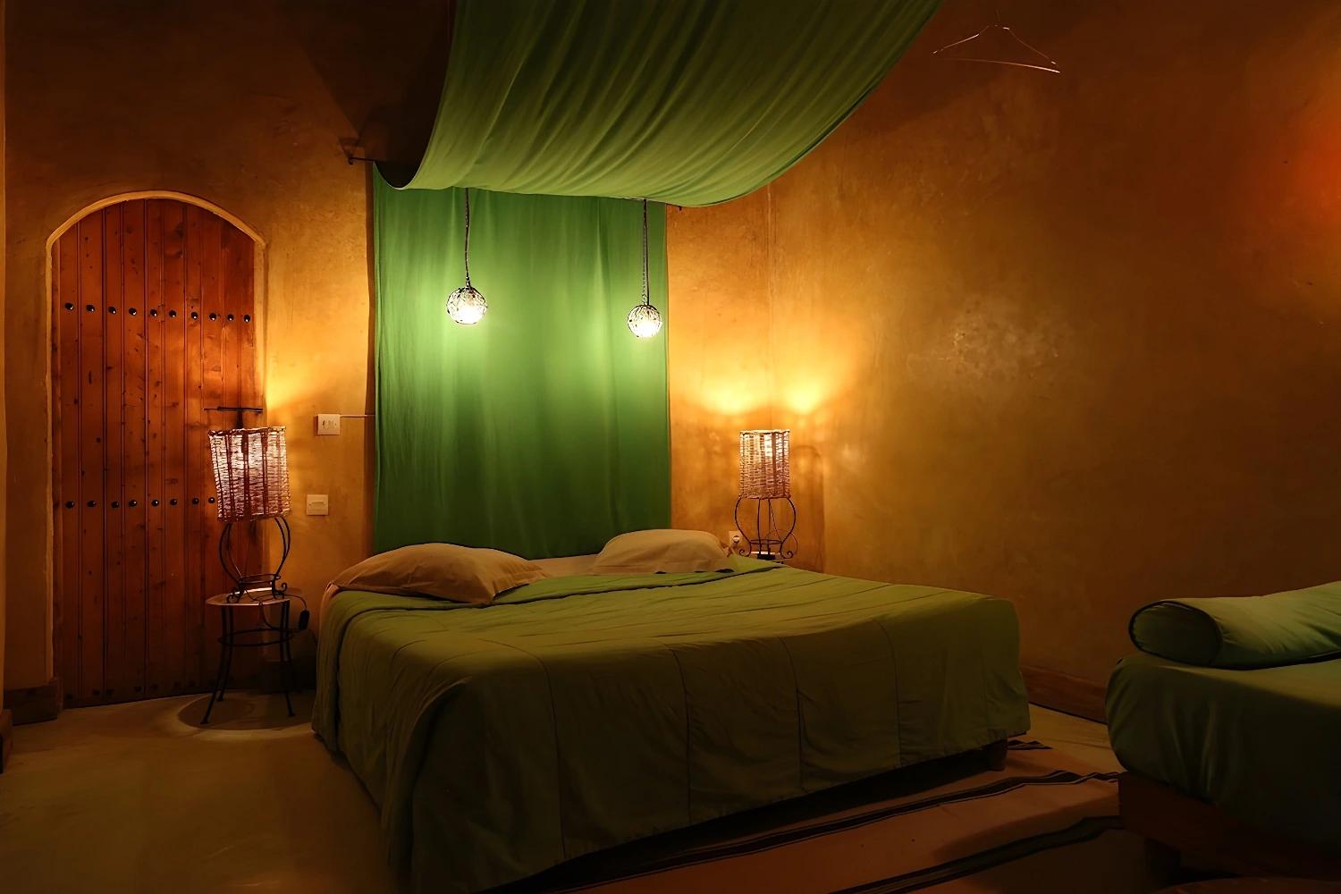 Chambre avec décoration verte à La Ferme Berbère