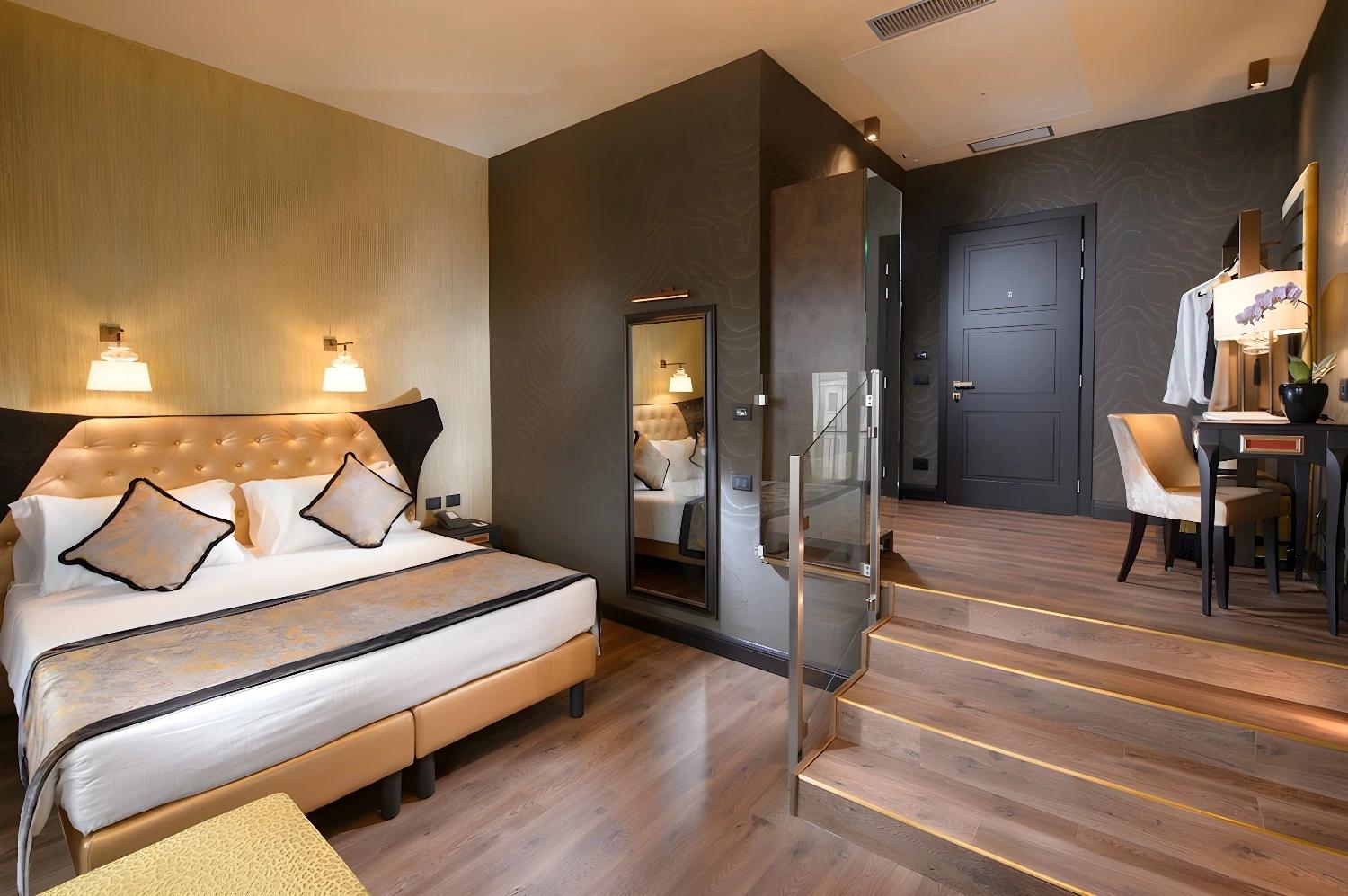 Cozy bedroom with unique window design at Palazzo Veneziano