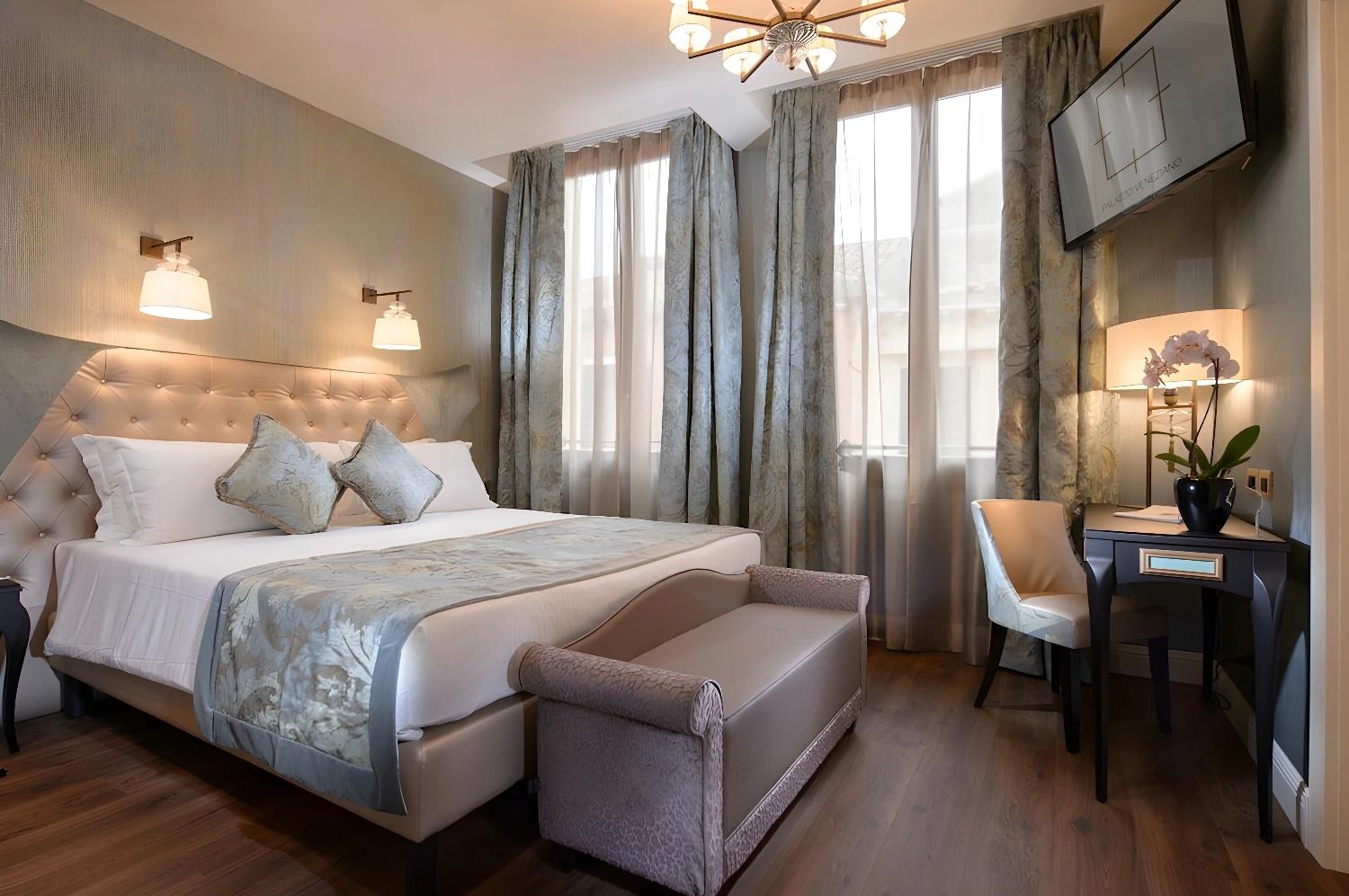 Elegant bedroom with natural light at Palazzo Veneziano