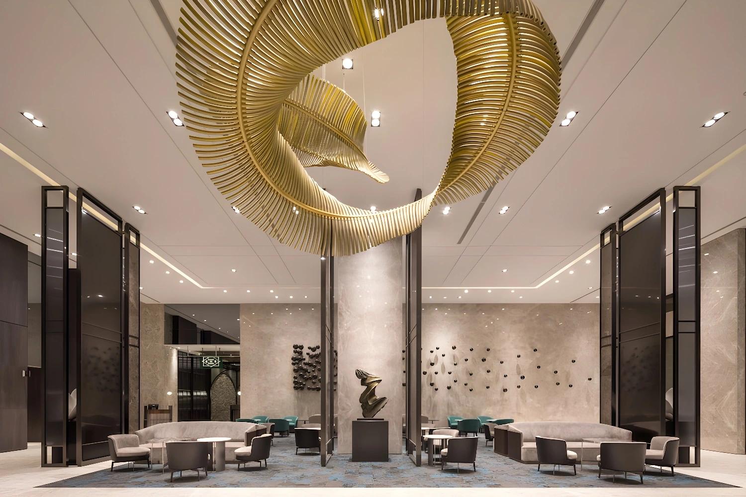 Lobby élégant du Lakeshore Hotel Tainan avec sculpture et décoration moderne.